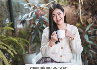 Portrait Beautiful Young Asian Woman Girl Wearing Warm Clothes Enjoys Drinking Holding Of Positive The Having Cup Of Coffee,milk Or Chocolate At House Home In The Living Room Inside Or Cafe