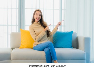 Portrait Beautiful Young Asian Woman Relax Leisure Enjoy On Sofa In Living Room Interior Area