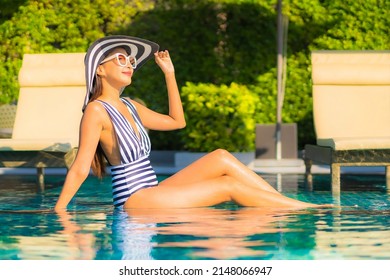 Portrait Beautiful Young Asian Woman Relax Smile Leisure On Vacation Around Swimming Pool In Resort Hotel