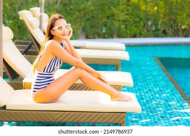 Portrait Beautiful Young Asian Woman Relax Smile Leisure On Vacation Around Swimming Pool In Resort Hotel