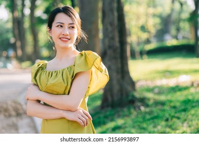 Portrait Of Beautiful Young Asian Woman With Sunshine