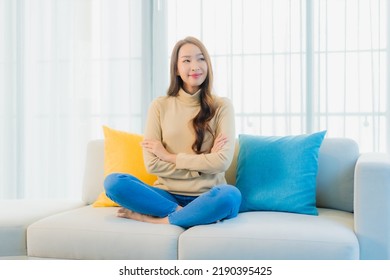 Portrait Beautiful Young Asian Woman Relax Leisure Enjoy On Sofa In Living Room Interior Area