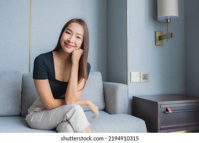 Portrait Beautiful Young Asian Woman Sit On Sofa Relax In Living Room Area