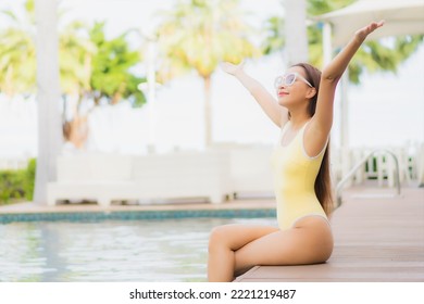 Portrait beautiful young asian woman relax smile leisure around outdoor swimming pool in holiday vacation travel trips - Shutterstock ID 2221219487