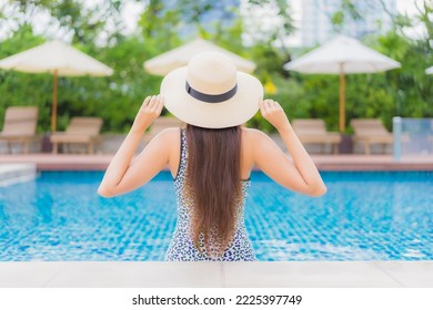 Portrait beautiful young asian woman relax smile leisure around outdoor swimming pool in holiday vacation travel trips - Shutterstock ID 2225397749