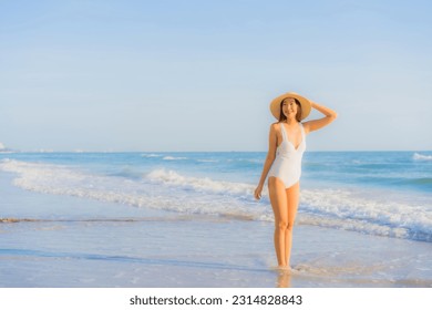 Portrait beautiful young asian woman happy smile around sea ocean beach and blue sky for leisure travel vacation - Powered by Shutterstock