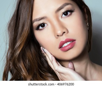 portrait of beautiful young asian woman with flawless skin and perfect make-up