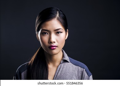 Portrait of Beautiful Young Asian Woman Being Serious