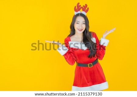 Portrait beautiful young asian woman wear christmas costume on color background