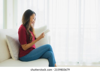 Portrait Beautiful Young Asian Women Read Book On Sofa Chair In Living Room Area