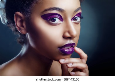 The Portrait Of Beautiful Young Black Girl In Violet Color Close Up