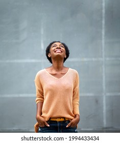 Portrait Beautiful Young Black Woman Looking Up And Smiling