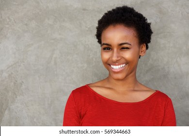 Portrait Of Beautiful Young Black Woman Winking Eye And Smiling