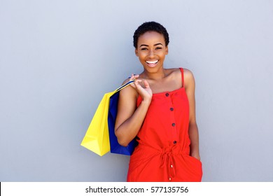 Portrait Of Beautiful Young Black Woman Smiling With Shopping Bags 