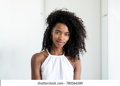 Portrait of a beautiful young black woman looking into camera 
 - Powered by Shutterstock