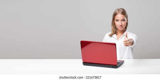 Portrait Of A Beautiful Young Blond Computer User.