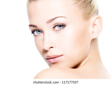 Portrait of beautiful young blond woman with clean face.  High key shot.
