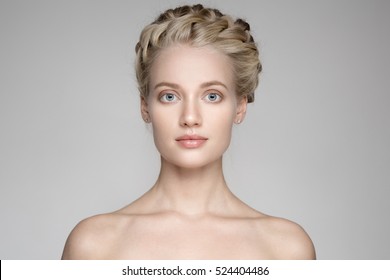 Portrait Of Beautiful Young Blond Woman With Braid Crown Hairstyle.