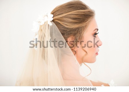 Portrait of beautiful young blond woman on white background