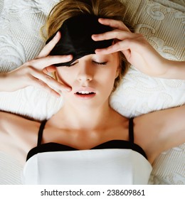 Portrait Of A Beautiful Young Blonde Woman Sleeping In A Mask For Sleep