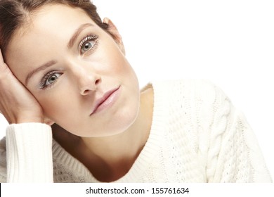 Portrait Of A Beautiful Young Bored Woman On A White Background