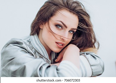 Portrait of beautiful young brunette woman with makeup - Shutterstock ID 706072303