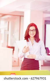 Portrait Beautiful Young Businesswoman Holding Spiral Book In Office