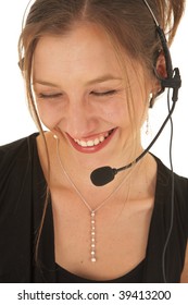 Portrait Of A Beautiful Young Caucasian Businesswoman Wearing Phone Headset On White Background. NOT ISOLATED