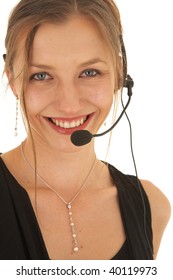 Portrait Of A Beautiful Young Caucasian Businesswoman Wearing Phone Headset On White Background. NOT ISOLATED