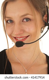 Portrait Of A Beautiful Young Caucasian Businesswoman Wearing Phone Headset On White Background. NOT ISOLATED