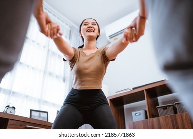 Portrait Of Beautiful Young Couple Exercising Together. Healthy Lifestyle At Home