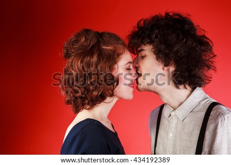 Similar – Young couple in love are posing face to face