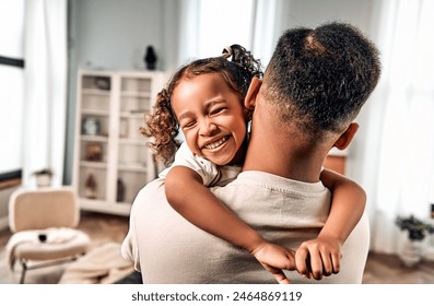 Portrait of beautiful, young, cute, cheerful, sincere girl, child, laughs, hugs dad. Love and care. Father's day concept. - Powered by Shutterstock