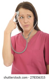 Portrait Of A Beautiful Young Female Doctor In Her Twenties Acting Silly And Playful With A Stethoscope