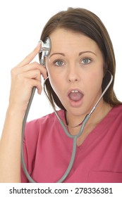 Portrait Of A Beautiful Young Female Doctor In Her Twenties Acting Silly And Playful With A Stethoscope