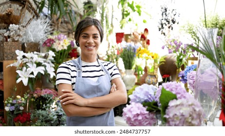 Portrait of a beautiful, young florist working at her store - Powered by Shutterstock