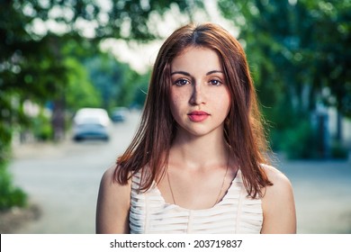 Portrait of a beautiful young girl head and shoulders.