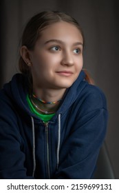 Portrait Of A Beautiful Young Girl In A Home Photo Studio. Artistic Noise.