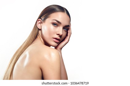 Portrait Of A Beautiful Young Girl With Natural Make-up And Well-groomed Hair On A White Background In The Studio.fashion, Beauty, Makeup, Cosmetics, Beauty Salon, Style, Personal Care, Posture, Hair.