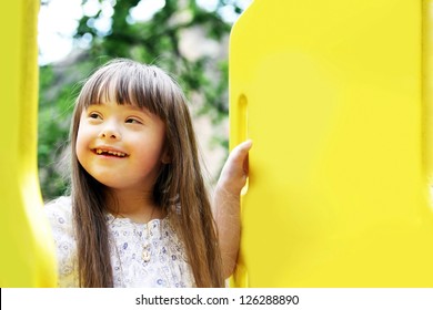 Portrait of beautiful young girl on the playground - Shutterstock ID 126288890