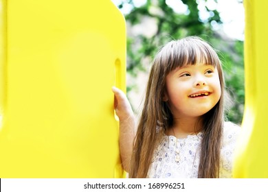 Portrait of beautiful young girl on the playground - Shutterstock ID 168996251