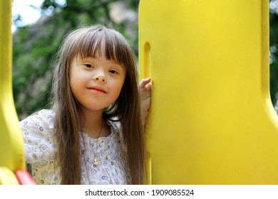 Portrait of beautiful young girl on the playground. - Shutterstock ID 1909085524