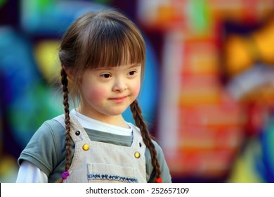 Portrait of beautiful young girl on the playground.