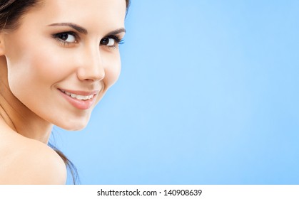 Portrait Of Beautiful Young Happy Smiling Woman, Over Blue Background