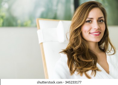 Portrait Of A Beautiful Young  Healthy Woman Relaxing In A Robe