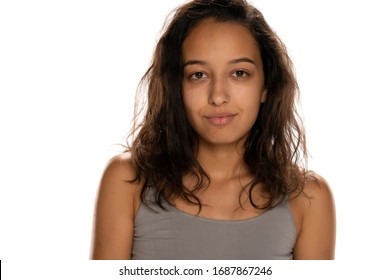 portrait of beautiful young latin woman without makeup on white background