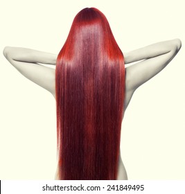 Portrait Of Beautiful Young Nude Woman With Long Red Hair. View From Back Side