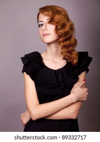 Portrait Of Beautiful Young Redhead Woman With Vintage Hair Style.