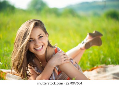 Portrait of a beautiful young smiling girl
