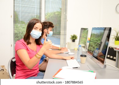 Portrait Of Beautiful Young Student In School Classroom Wearing A Covid 19 Surgical Mask Protection